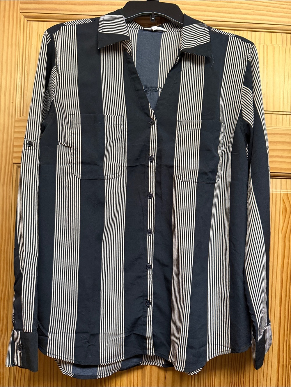 Maurice’s black and tan vertical striped blouse with roll up sleeves.